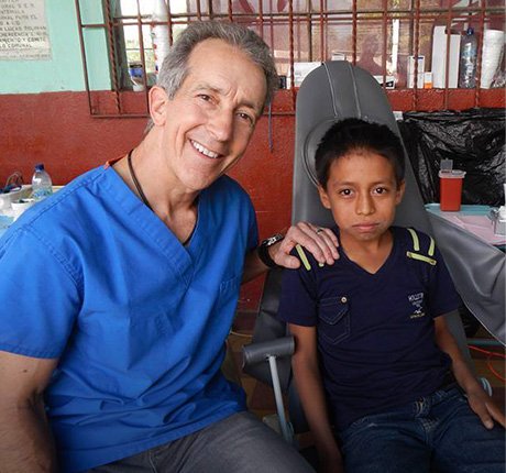 Dr. McKnight with patient on mission trip